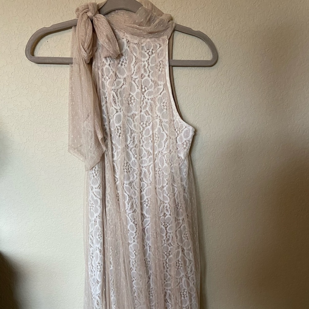 White lace dress with tan tule tie neck